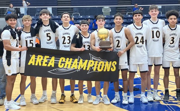 Area champions--Indian basketball players pose with the area trophy after defeating El Paso Bowie 73-62 on Feb. 26.
