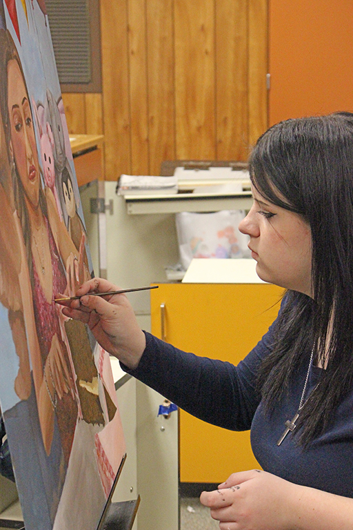 Party scene--
Junior Dacey Peters works on her VASE entry during ninth period art class in January. The oil painting depicts a young woman at a party.